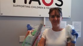 Volunteer Alison delivers art supplies