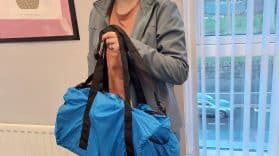 Laura holding large blue bag
