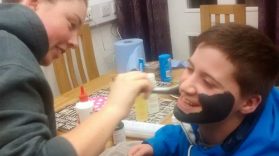Young people putting on Facemasks